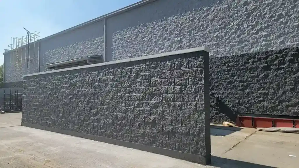 Completed concrete block wall and trash enclosure coating repair at a Sam's Club commercial property by Plaster Pro Stucco Contractors serving North Jersey