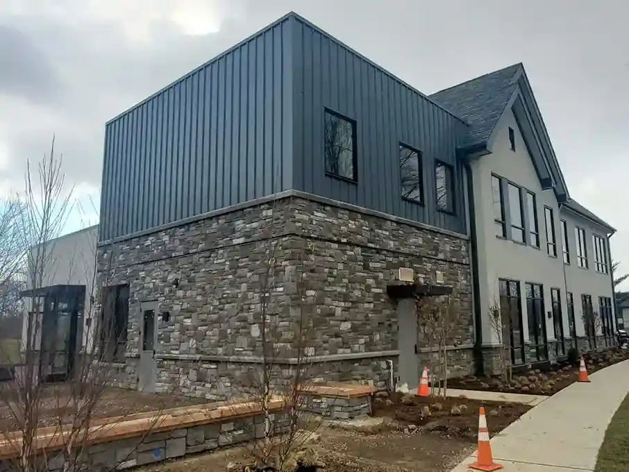 Modern commercial building with stone facade on the lower exterior and stucco finish on the upper section completed by Plaster Pro Stucco Contractors serving North Jersey