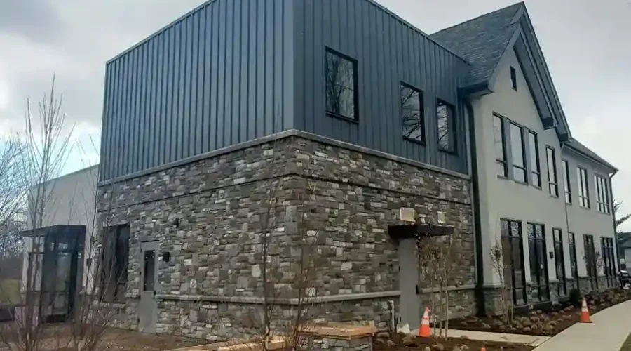 Modern commercial building with stone facade on the lower exterior and stucco finish on the upper section completed by Plaster Pro Stucco Contractors serving North Jersey